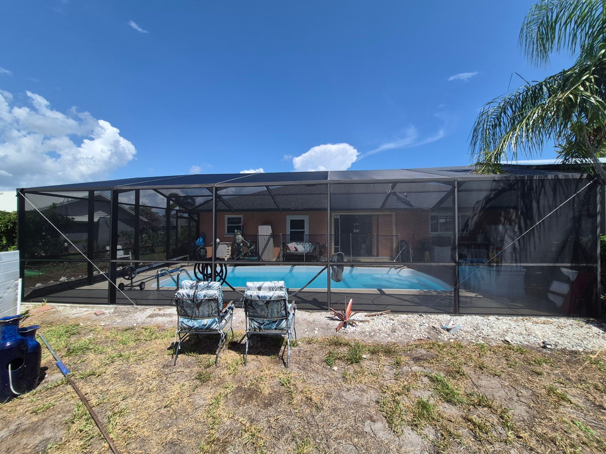 Pool cage screen enclosure with in-ground pool in Englewood, FL