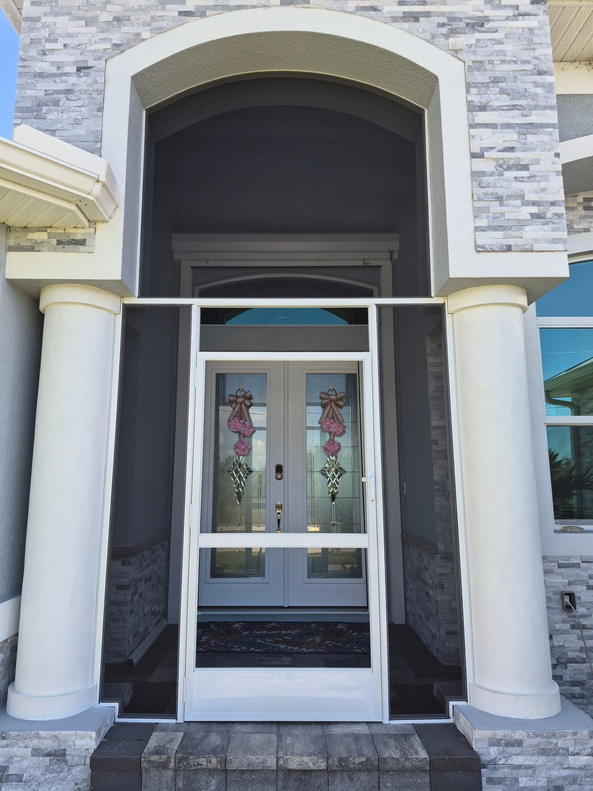 Screened front entry porch with double doors in Port Charlotte, FL