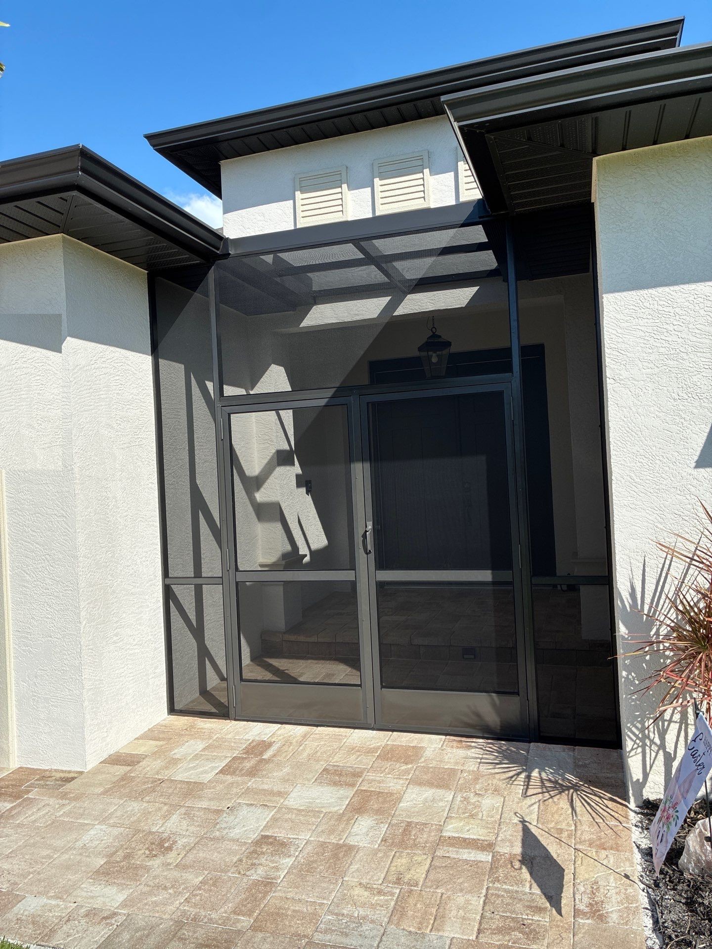 Screened front entry of a pool cage enclosure in Rotonda West, FL