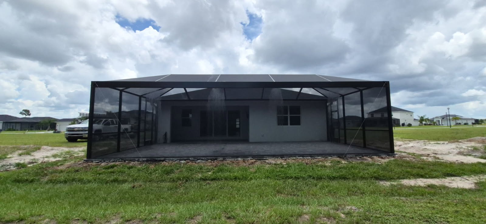New screen enclosure over a paver lanai on a new construction home in Willow, Punta Gorda, FL, built by Screen Experts, LLC